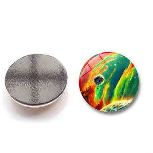 Detail of round galaxy nebula glass magnets showing vibrant space prints and magnetic back