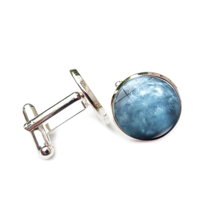 Detailed view of silver cufflinks with blue galaxy nebula glass dome insert for men