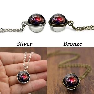 Detail of double-sided glass galaxy nebula pendant necklace in silver and bronze finish