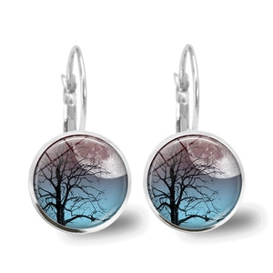 Silver Tree of Life time gem earrings with artistic moonlit landscape on white background