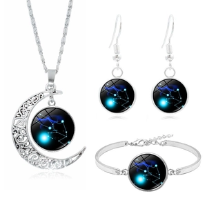 Detail view of silver Taurus zodiac jewelry set with necklace, bracelet and earrings