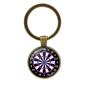Close-up of dartboard key ring with vintage bronze finish and convex glass dome