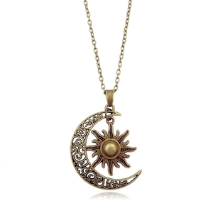 Vintage sun and crescent moon pendant necklace in bronze finish with a dainty chain