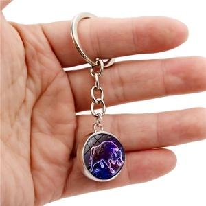 Luminous Taurus zodiac keychain with double-sided crystal ball pendant in silver metal