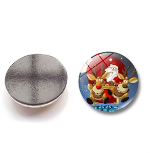 Detail view showing Santa Claus in a reindeer sleigh on a round 25mm crystal fridge magnet