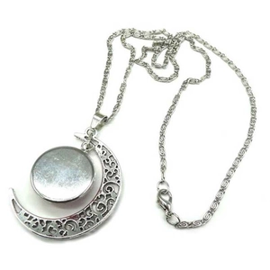 Detail of silver hollow crescent moon necklace with round gemstone pendant inlay