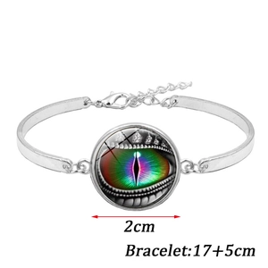 Detail of silver bracelet featuring a 2cm rainbow dragon eye glass cabochon with lobster clasp