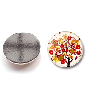Detail view of the Tree of Life glass fridge magnet with colorful floral patterns and magnetic back