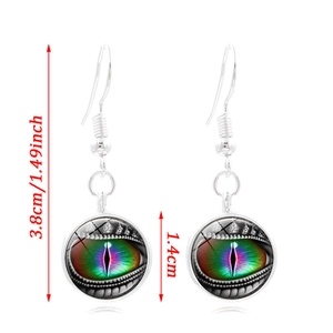 Detailed view of silver hook earrings with rainbow dragon eye glass gemstone pendants