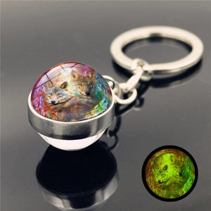 Glow-in-the-dark dreamcatcher wolf art glass ball keychain with luminous green light effect