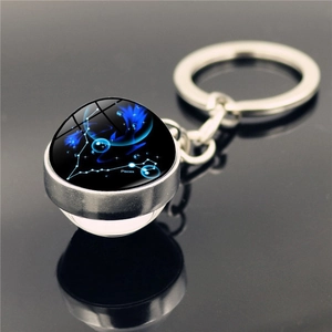 Pisces zodiac crystal ball keychain with silver metal ring and constellation design