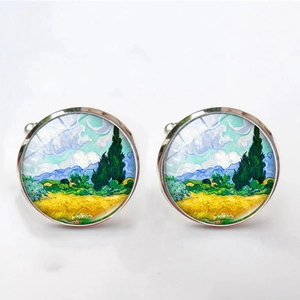 Detailed macro view of silver cufflinks featuring Van Gogh impressionist oil painting art