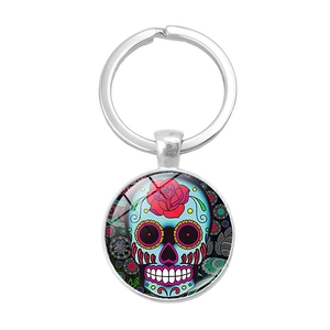 Porte-clés Jour des Morts mexicain avec crâne en sucre bleu et pendentif de rose