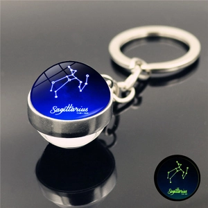 Luminous Sagittarius zodiac keychain with glowing glass ball and silver metal base