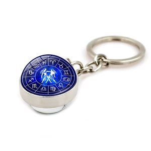 Luminous Gemini zodiac keychain with silver metal alloy base and blue glass cabochon pendant