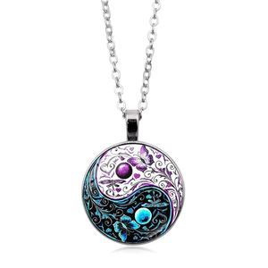 Silver Tai Chi Yin Yang pendant necklace with butterfly and floral glass cabochon