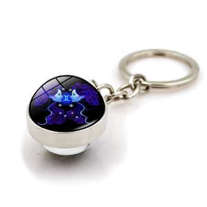 Gemini zodiac keychain with double-sided glass dome and polished silver metal ring
