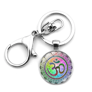Detail of silver Om symbol mandala flower keychain with lobster clasp and colorful pendant