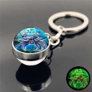Luminous Cancer zodiac keychain with crystal glass ball and glowing green effect