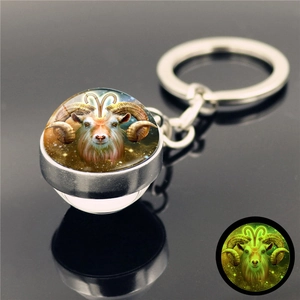 Luminous Aries constellation keychain with glow-in-the-dark glass ball and metal ring