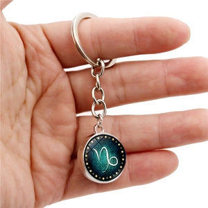 Porte-clés Capricorne lumineux avec boule de verre double face et pendentif ciel étoilé bleu