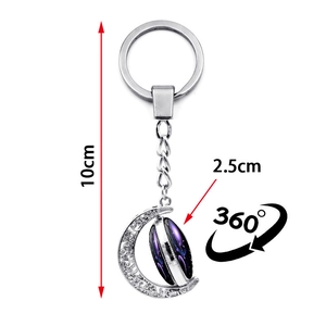 Luminous constellation crescent moon keychain with double-sided 360-degree rotating star ball