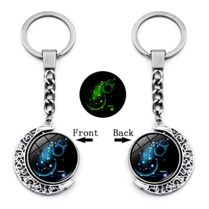 Luminous Aquarius zodiac moon keychain with glowing double-sided rotating metal design