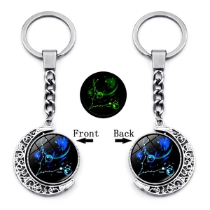 Luminous double-sided rotating Pisces zodiac crescent moon keychain in silver finish