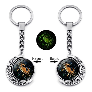 Luminous double-sided rotating moon keychain with glowing Cancer zodiac symbol