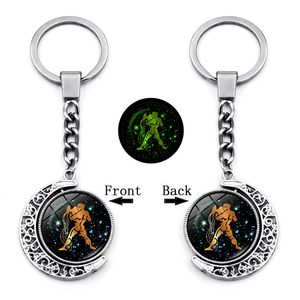 Luminous Aquarius zodiac keychain featuring a rotating double-sided crescent moon pendant