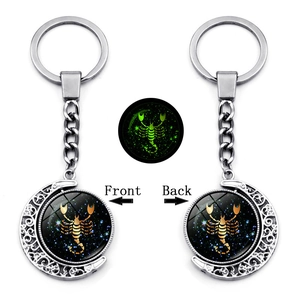 Luminous Scorpio keychain with double-sided rotating moon pendant and glow feature