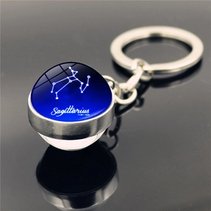 Double-sided Sagittarius glass ball keychain with silver metal frame and blue starry sky