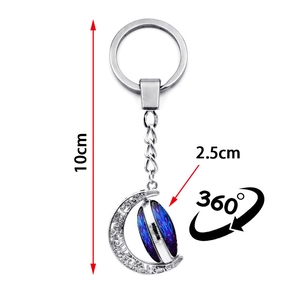 Luminous constellation keychain with rotating moon pendant in silver alloy finish