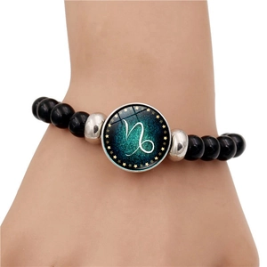 Handmade black beaded Capricorn zodiac bracelet with celestial glass gem pendant