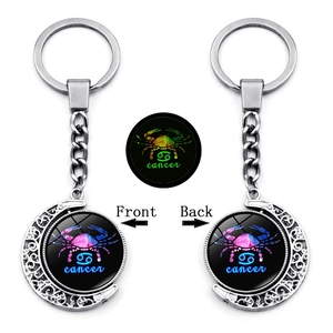 Luminous Cancer constellation rotating moon keychain with double-sided silver alloy design