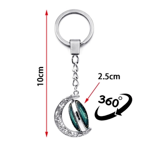 Luminous 360 degree rotating moon keychain with green starry galaxy pendant