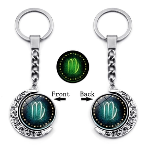 Detailed front and back view of a rotating Virgo zodiac moon keychain in silver finish