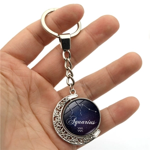 Glow-in-the-dark Aquarius constellation moon keychain with rotating glass pendant charm