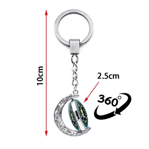 Luminous 12 constellation spinning moon keychain in silver metal with zodiac theme