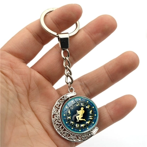 Luminous Aquarius zodiac keychain with rotating moon pendant and double-sided star map
