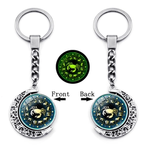 Glow-in-the-dark double-sided rotating moon keychain with Cancer zodiac sign theme