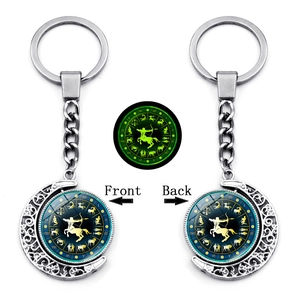 Luminous Sagittarius keychain with rotating double-sided moon crescent and glow effect