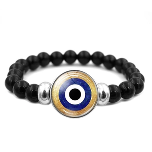 Bracciale occhio turco blu con perle nere e ciondolo portafortuna dorato
