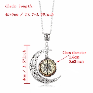 Vintage silver crescent moon necklace with compass pattern glass gem and镂空 detail