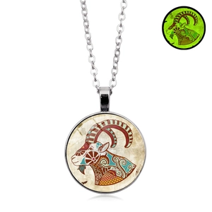 Luminous Aries zodiac necklace with silver chain and glass pendant glowing in the dark