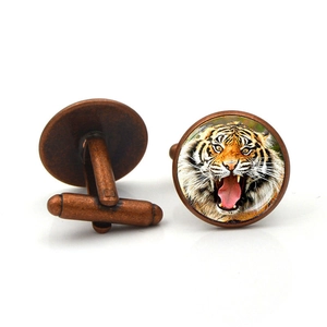 Vintage copper cufflinks for men with a glass dome featuring a fierce tiger head design