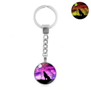 Luminous howling wolf silhouette keychain with silver metal ring and glow in dark design