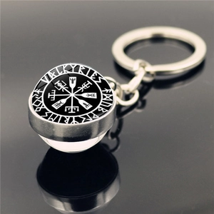 Detailed view of the double-sided glass pendant with Viking runes and Valkyrie logo