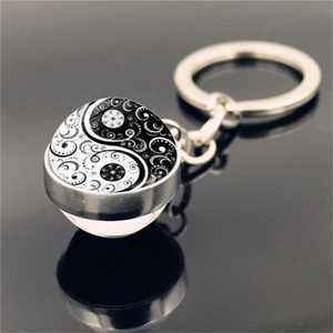 Double-sided Yin Yang Tai Chi glass ball keychain with mandala pattern on metal base