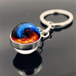 Detailed view of the double-sided yin yang keychain featuring water and fire elements